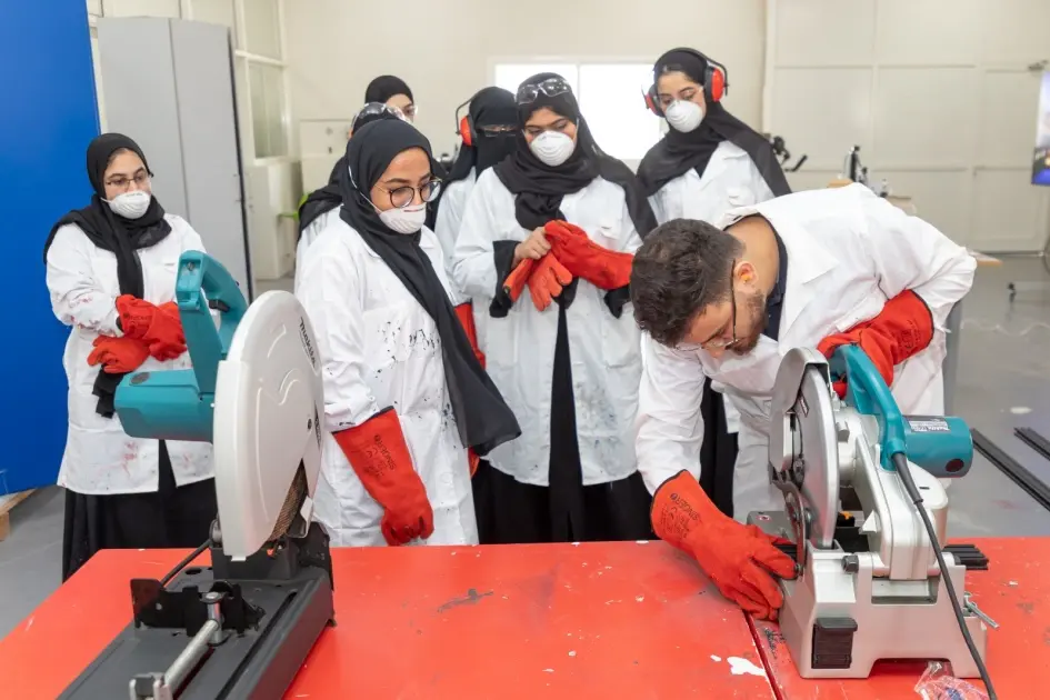 Students working with machinery during a Center programme